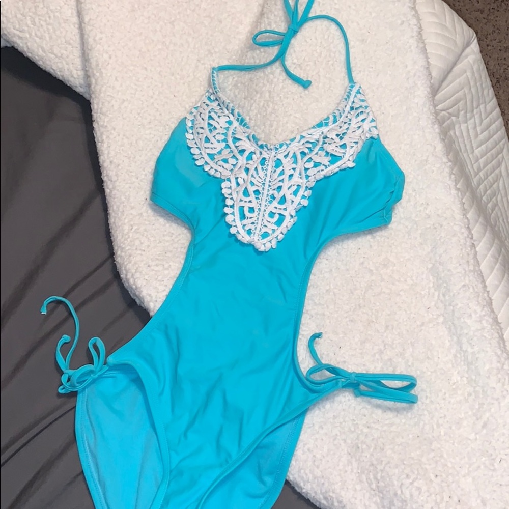 Teal one piece swimsuit with cutouts